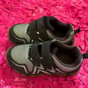 Black and silver shoe with no brand